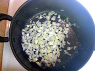 In a large skillet with a cover, sauté the onions and garlic in the oil. 