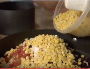 Adding corn to a dish