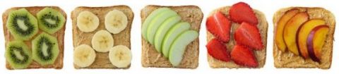 Sandwiches with peanut butter and fruits isolated on white background.
